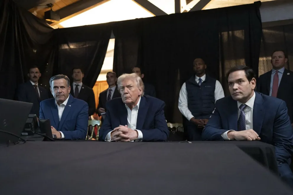 Al medio, Donald Trump, presidente de Estados Unidos.