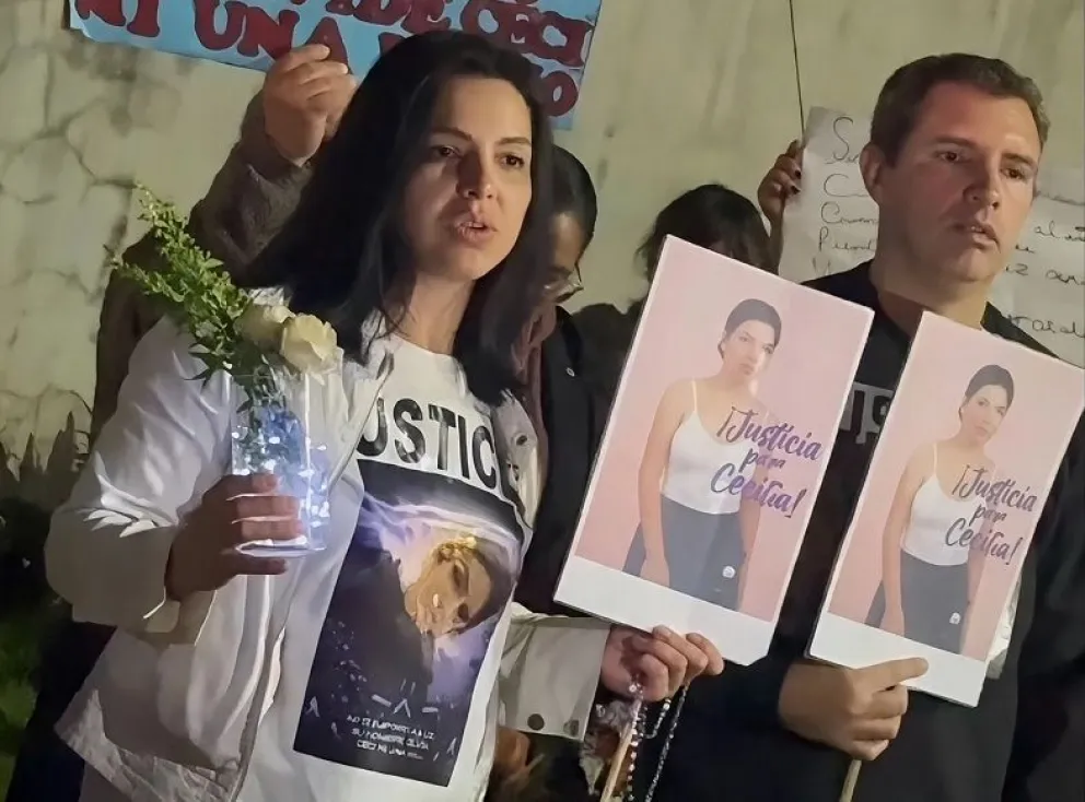 Sus padres en la marcha pidiendo justicia.